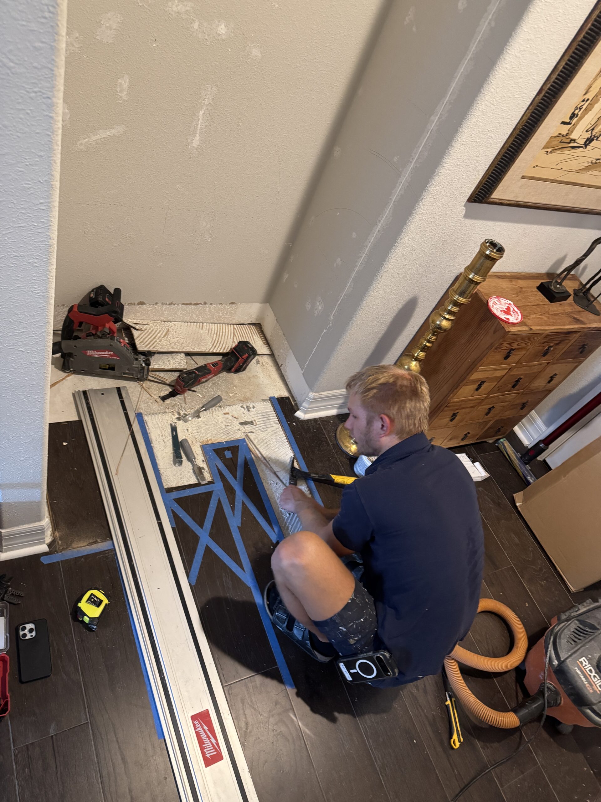 Hardwood floor repair in progress after built-in removal during a Nocatee hardwood floor repair project