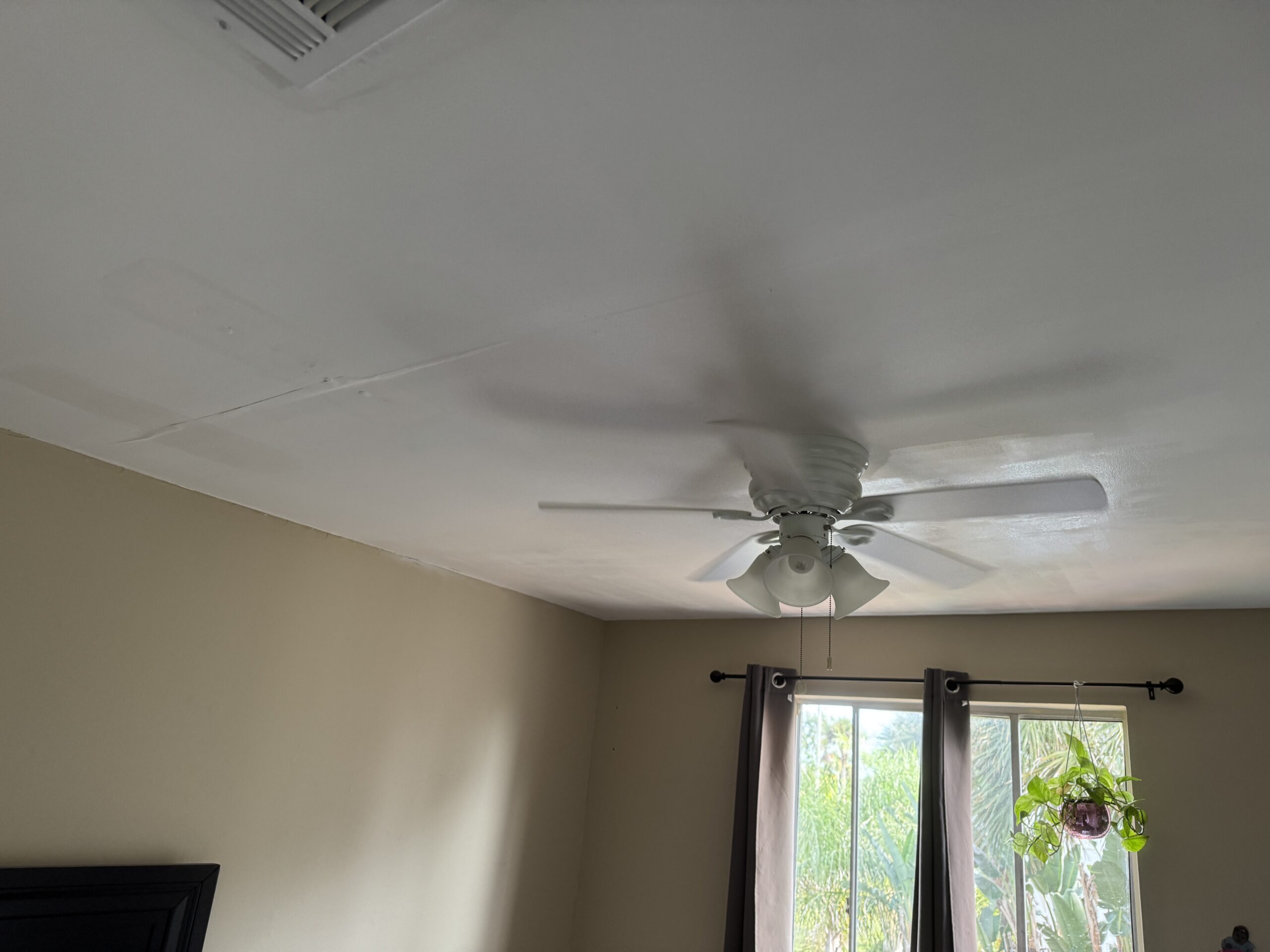 Ponte Vedra Ceiling Tape Repair — And the Sagging Drywall We Found Underneath 6 Sagging drywall being screwed back into the joists during a Ponte Vedra ceiling tape repair, step 5