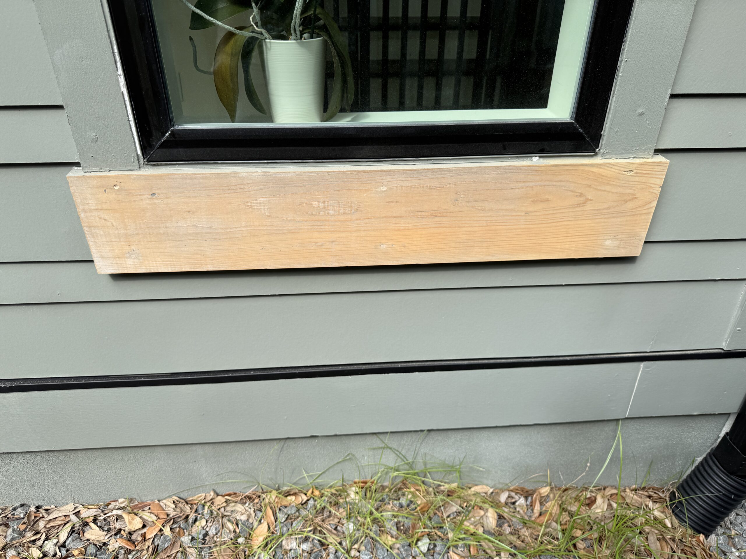Ponte Vedra Exterior Trim Refinish: Sun-Faded Wood, Sealed and Saved 8 Applying UV-resistant sealer to exterior trim during a Ponte Vedra trim refinish